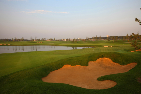 Golf course with ball near flag
