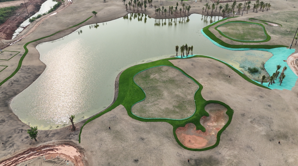Golf course with ball near flag